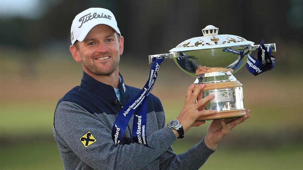 Bernd Wiesberger raises the trophy after capturing the 2019 Scottish Open.